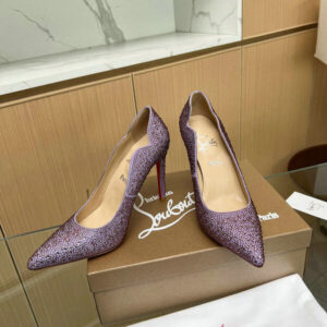 Elegant purple suede pumps with a distinctive wavy edge and comfortable fit.