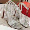 Christian Louboutin Joli Queen Glitter Sandals with crystal embellishments and red soles.