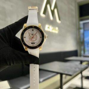 Gucci Dive Quartz Ladies Watch YA136322 with yellow gold PVD bezel, white rubber strap, and white feline head dial.